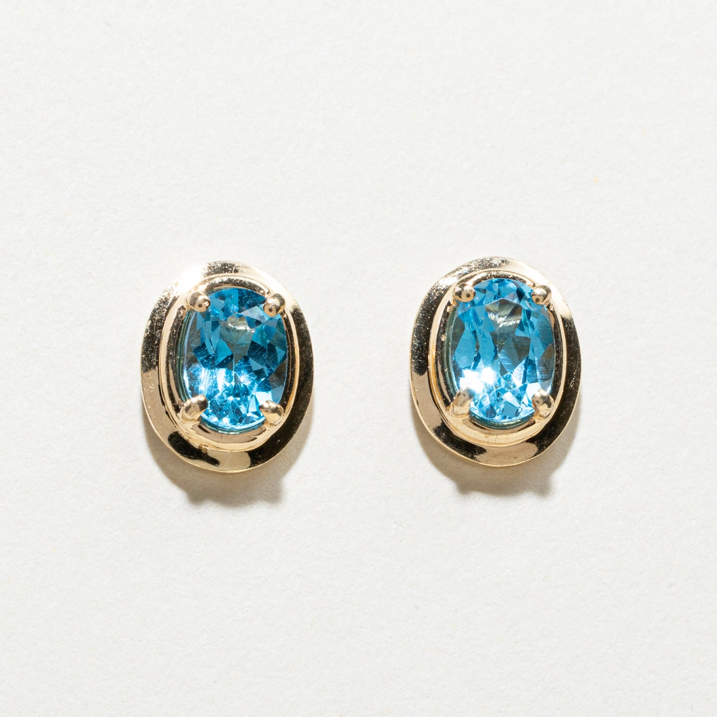 Polished Pieces Handcrafted Jewelry Finish 14K Oval Cut Blue Topaz Stud Earrings | 1.50ctw