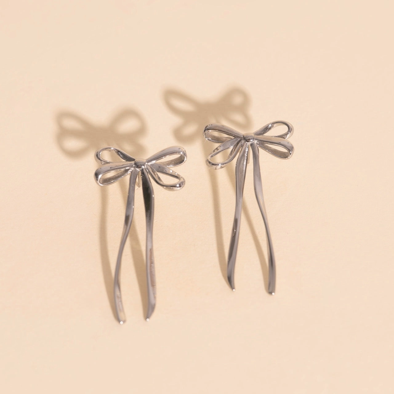 Dazzling Glow Bowknot Stud Earrings