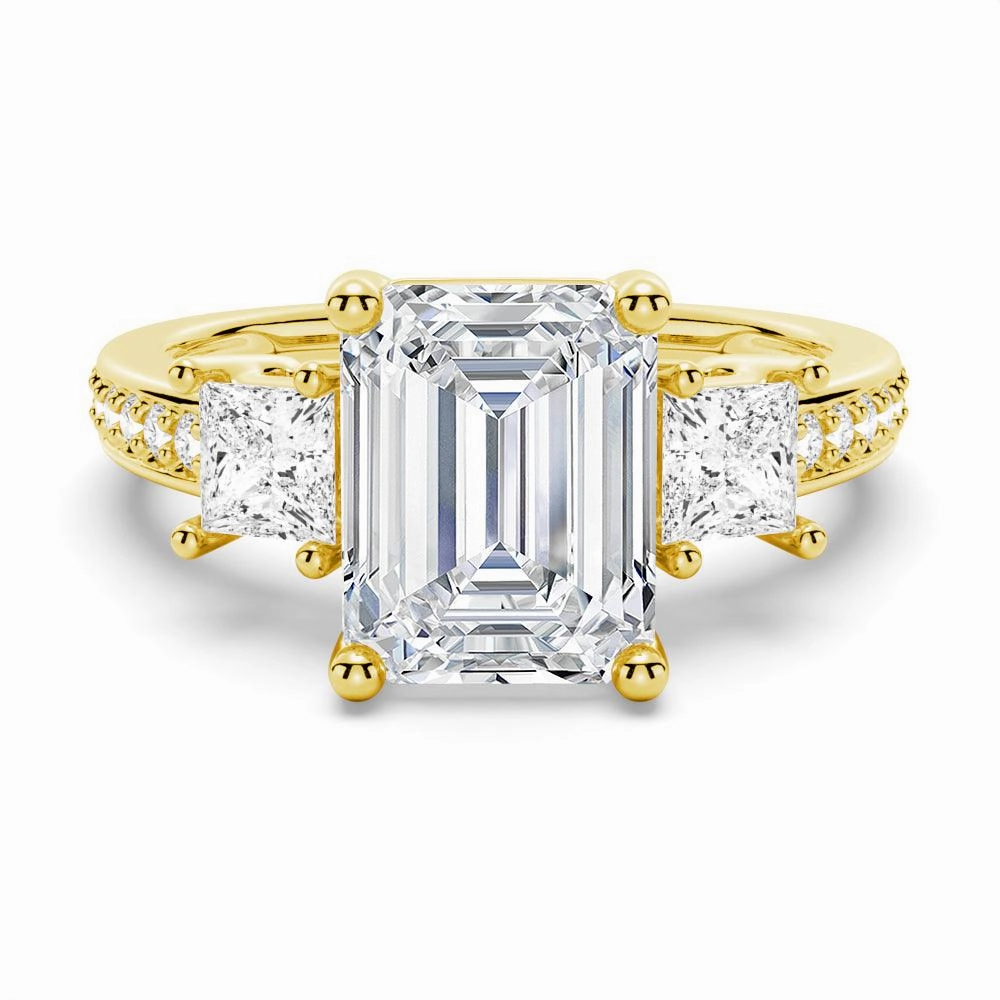 Etched Design Emerald Shaped Three Stone Engagement Ring