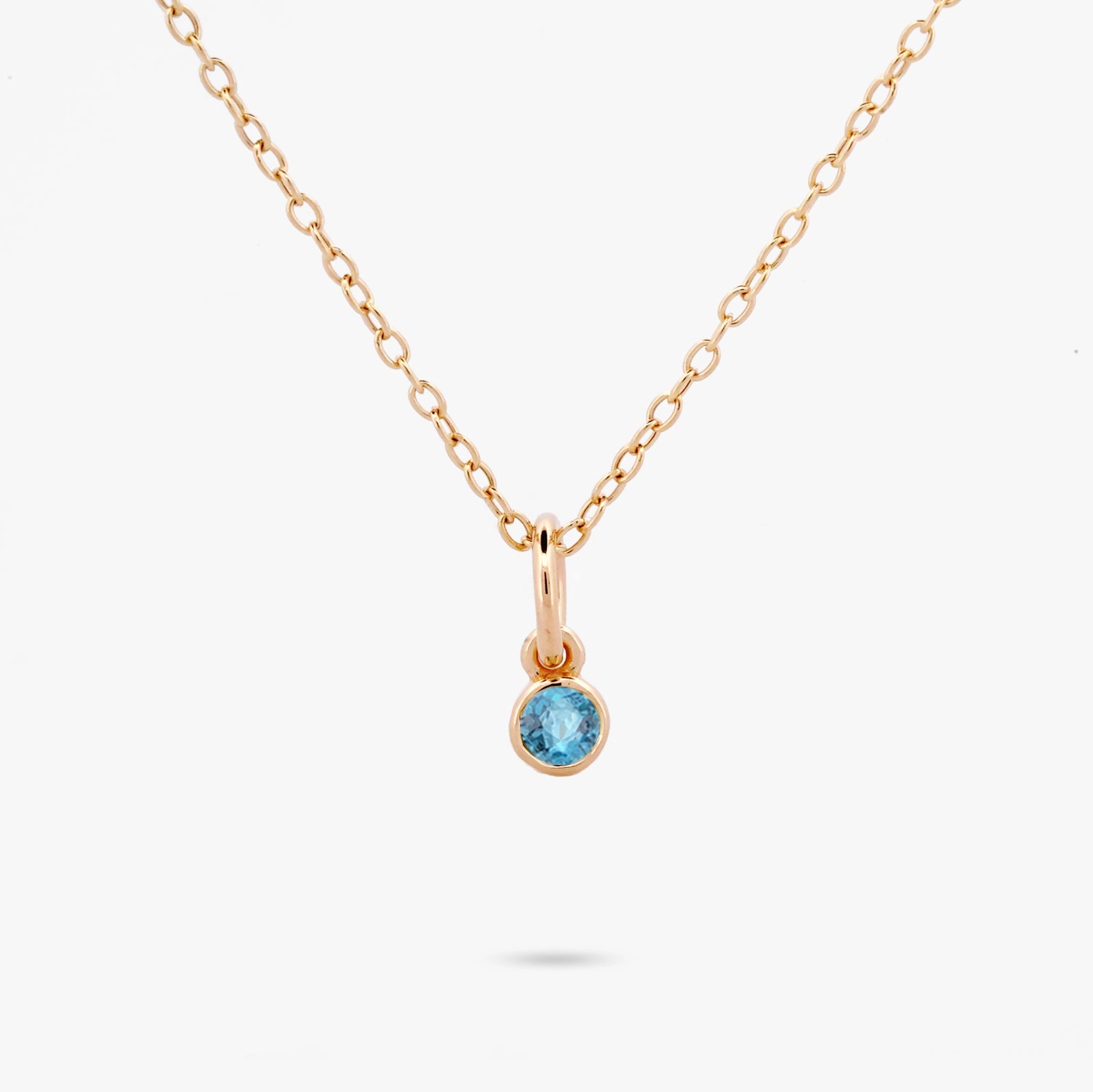 Charming Glow Celebration Bezel Set Necklace - Swiss Blue Topaz